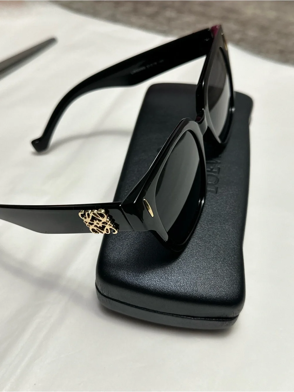 Black Designer Sunglasses with Gold Accent and branded case